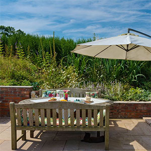  Outdoor seating for al fresco meals at Beili Glass Cottage